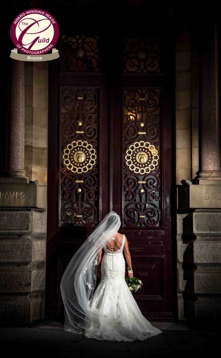 bride near big doors
