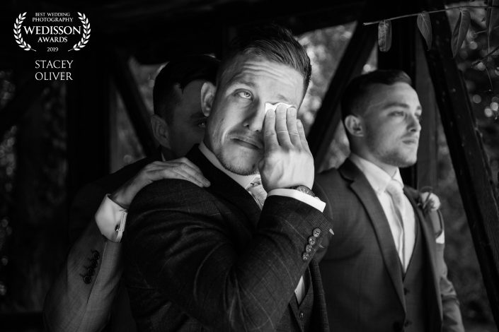 groom crying at the alter at wedding