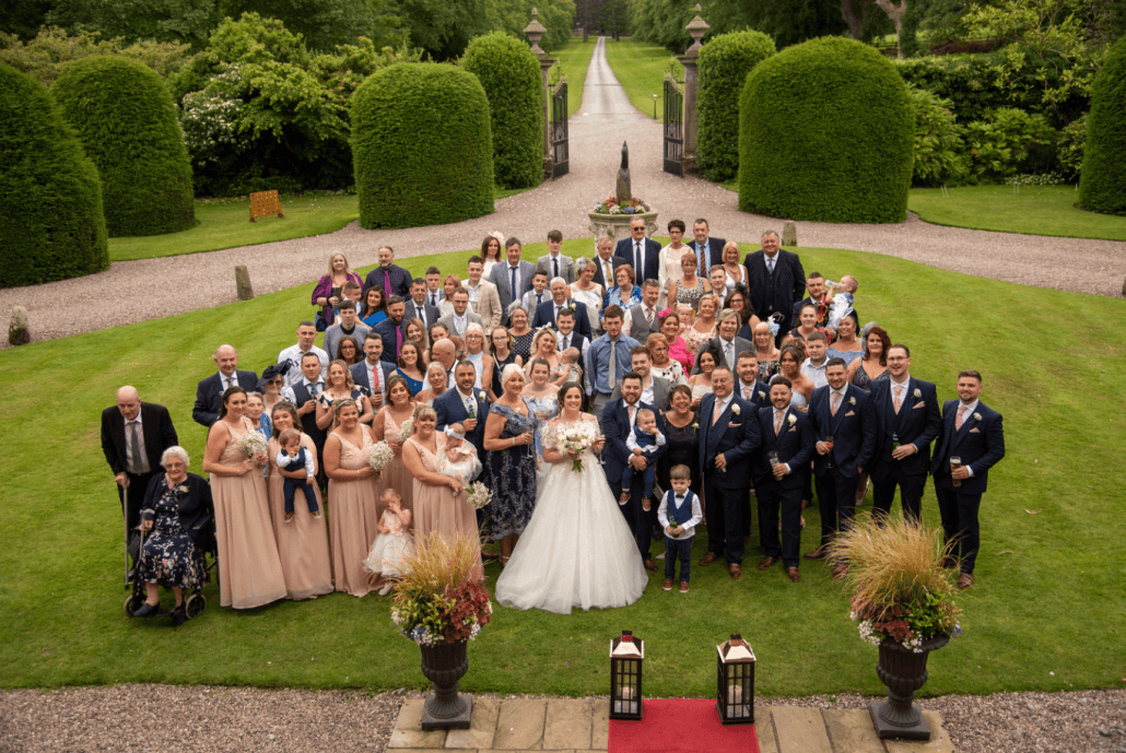 Group photo of wedding at Soughton Hall