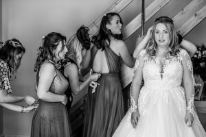 Bridal party getting ready and doing their dresses up