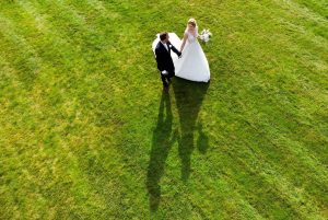 Bride and Groom on lawn